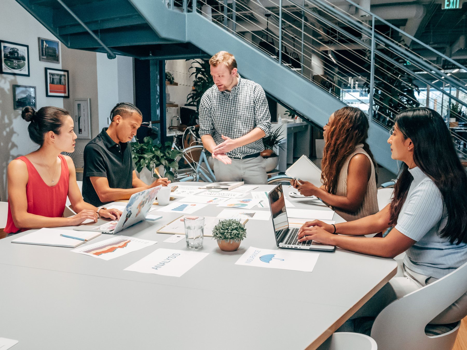 Customer-service, sales and operations leaders reviewing a connected customer relationship