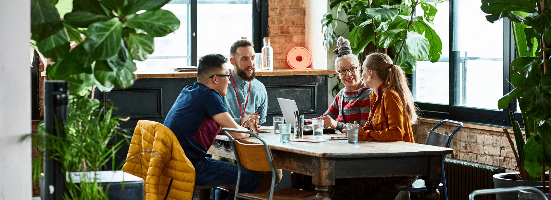 People from different organisations working together around one table