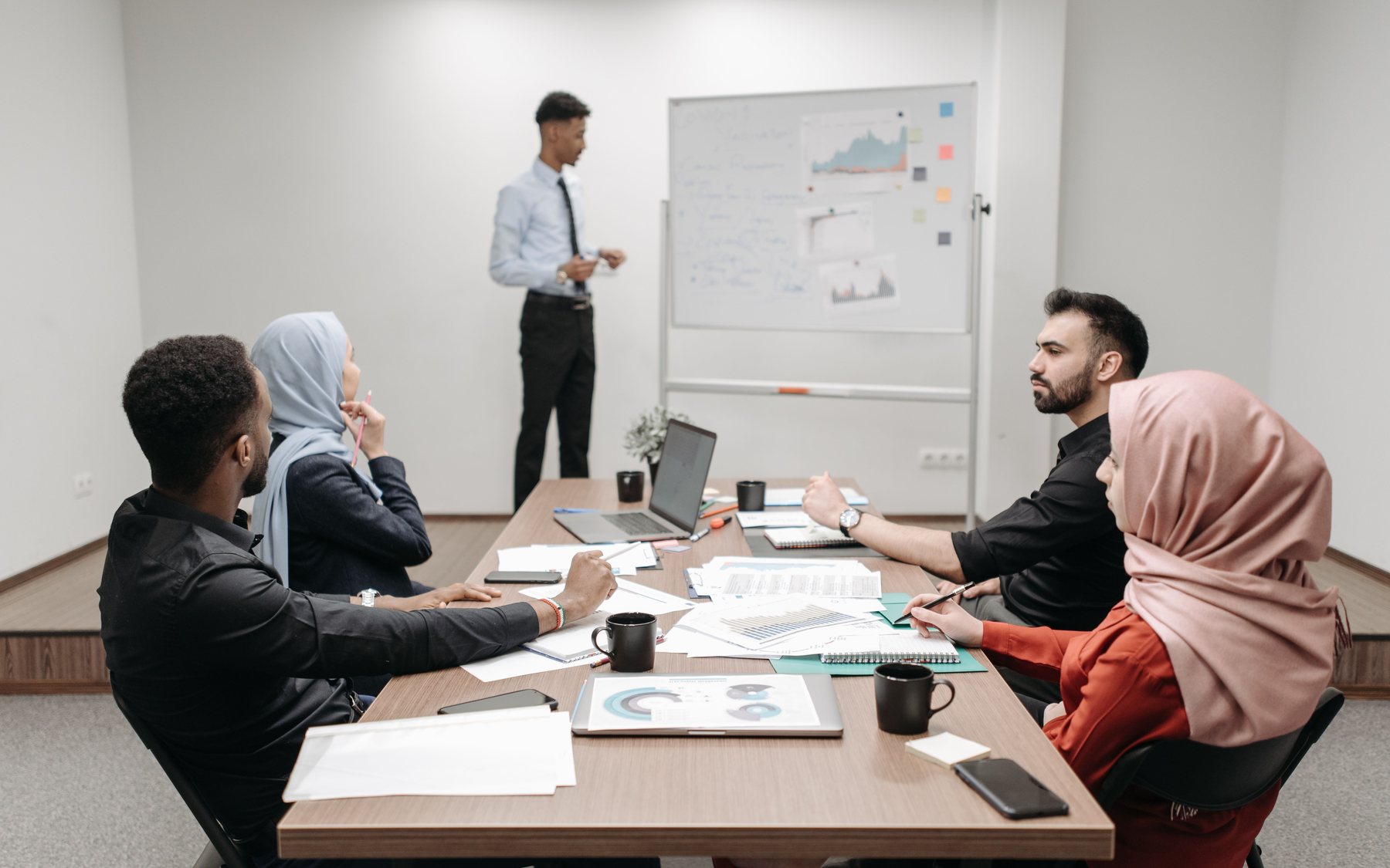 Enterprise architects and operational leaders reviewing a connected system landscape